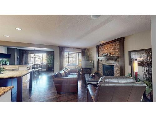 943 Auburn Bay Boulevard Se, Calgary, AB - Indoor Photo Showing Living Room With Fireplace