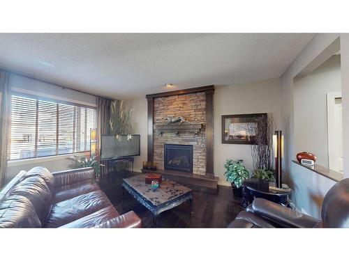 943 Auburn Bay Boulevard Se, Calgary, AB - Indoor Photo Showing Living Room With Fireplace