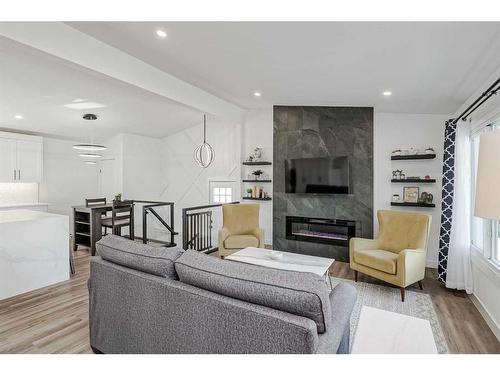 1315 105 Avenue Sw, Calgary, AB - Indoor Photo Showing Living Room With Fireplace