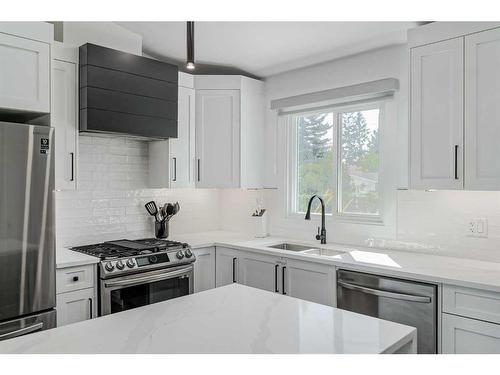 1315 105 Avenue Sw, Calgary, AB - Indoor Photo Showing Kitchen With Double Sink With Upgraded Kitchen