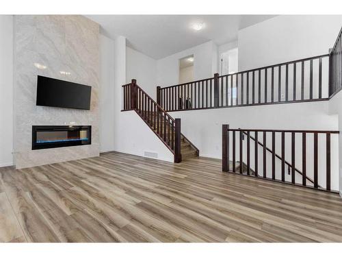 227 Carringham Road Nw, Calgary, AB - Indoor With Fireplace