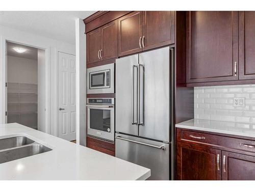 227 Carringham Road Nw, Calgary, AB - Indoor Photo Showing Kitchen With Stainless Steel Kitchen With Double Sink