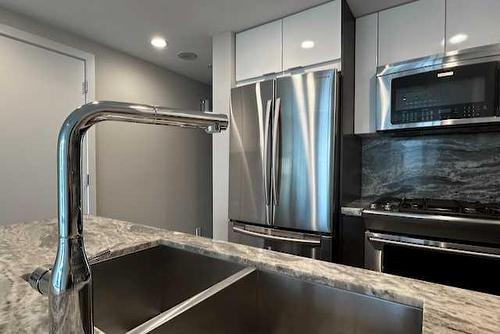 1505-519 Riverfront Avenue Se, Calgary, AB - Indoor Photo Showing Kitchen With Stainless Steel Kitchen