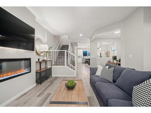 125 Dawson Drive, Chestermere, AB - Indoor Photo Showing Living Room With Fireplace