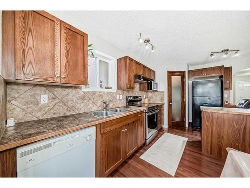 953 Taradale Drive Ne, Calgary, AB - Indoor Photo Showing Kitchen With Double Sink