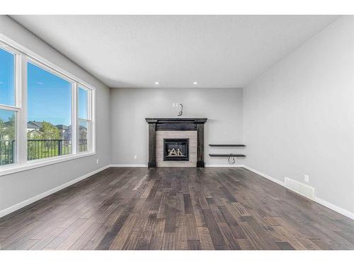 34 Panton Bay Nw, Calgary, AB - Indoor Photo Showing Living Room With Fireplace