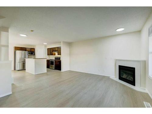 198 Panatella Park Nw, Calgary, AB - Indoor With Fireplace