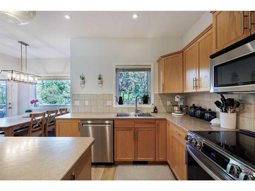 44 Tuscany Ridge Green, Calgary, AB - Indoor Photo Showing Kitchen With Double Sink