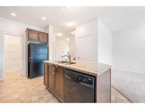 58 Sage Berry Way Nw, Calgary, AB - Indoor Photo Showing Kitchen With Double Sink