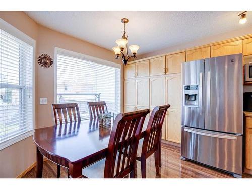 205 Coral Springs Close Ne, Calgary, AB - Indoor Photo Showing Living Room With Fireplace