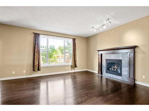 60 Westmount Way, Okotoks, AB - Indoor Photo Showing Living Room With Fireplace