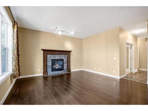 60 Westmount Way, Okotoks, AB - Indoor Photo Showing Living Room With Fireplace