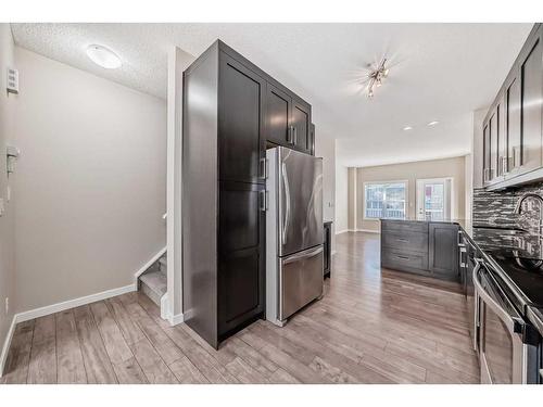 228 Marquis Lane Se, Calgary, AB - Indoor Photo Showing Kitchen With Stainless Steel Kitchen With Upgraded Kitchen