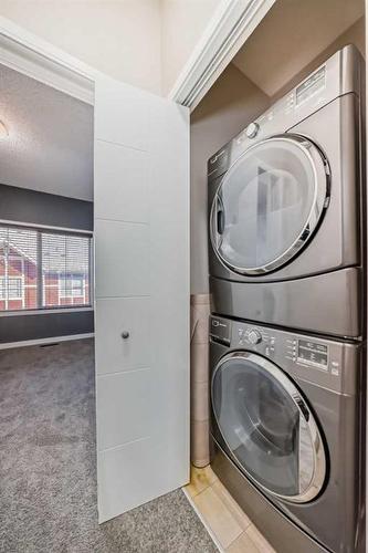 228 Marquis Lane Se, Calgary, AB - Indoor Photo Showing Laundry Room