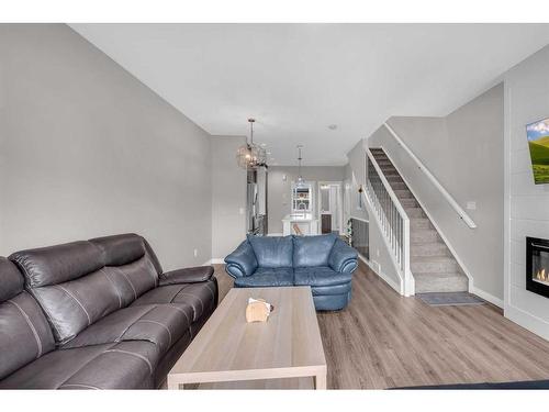 104-95 Skyview Close Ne, Calgary, AB - Indoor Photo Showing Living Room With Fireplace