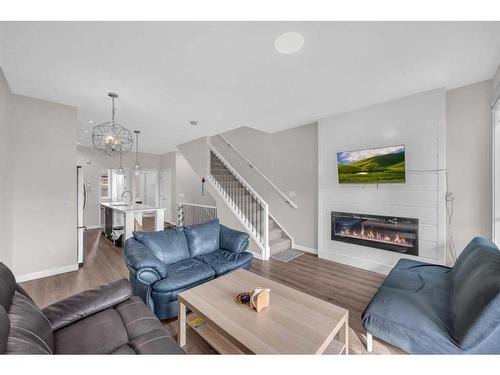 104-95 Skyview Close Ne, Calgary, AB - Indoor Photo Showing Living Room With Fireplace