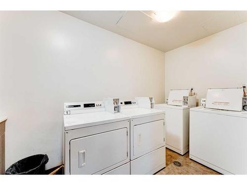 209-812 8 Street Se, Calgary, AB - Indoor Photo Showing Laundry Room