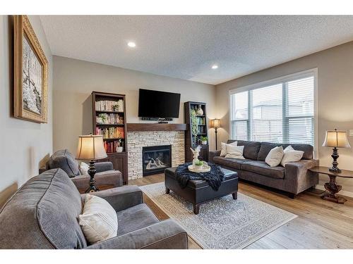 1212 Brightoncrest Common Se, Calgary, AB - Indoor Photo Showing Living Room With Fireplace