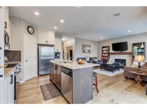 1212 Brightoncrest Common Se, Calgary, AB - Indoor Photo Showing Kitchen With Fireplace With Upgraded Kitchen