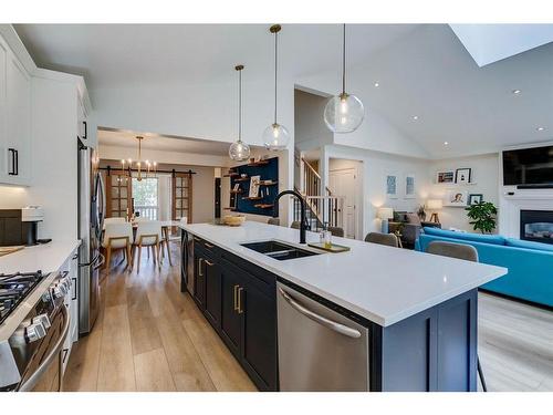 354 Mountain Park Drive Se, Calgary, AB - Indoor Photo Showing Kitchen With Fireplace With Double Sink With Upgraded Kitchen