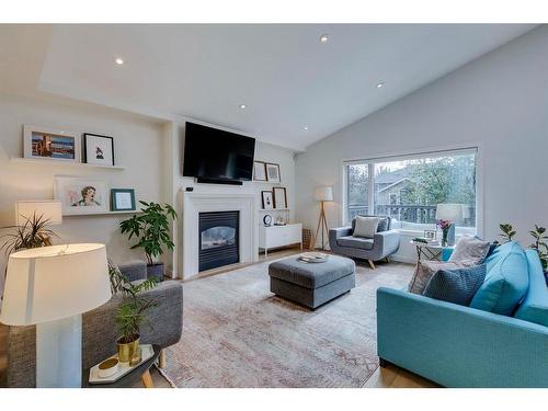 354 Mountain Park Drive Se, Calgary, AB - Indoor Photo Showing Living Room With Fireplace