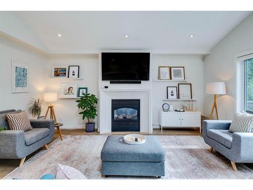 354 Mountain Park Drive Se, Calgary, AB - Indoor Photo Showing Living Room With Fireplace