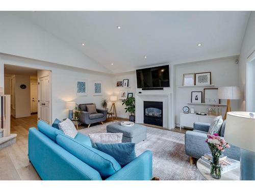 354 Mountain Park Drive Se, Calgary, AB - Indoor Photo Showing Living Room With Fireplace