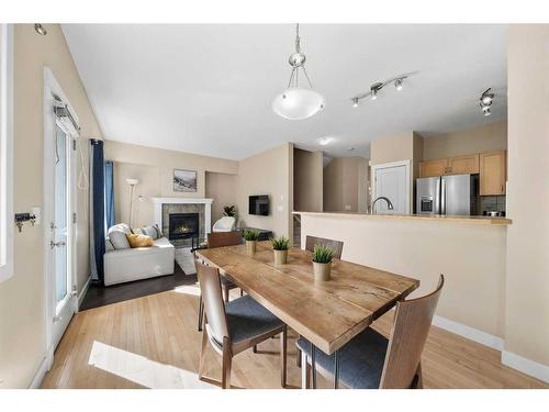 271 Cranston Drive Se, Calgary, AB - Indoor Photo Showing Dining Room With Fireplace