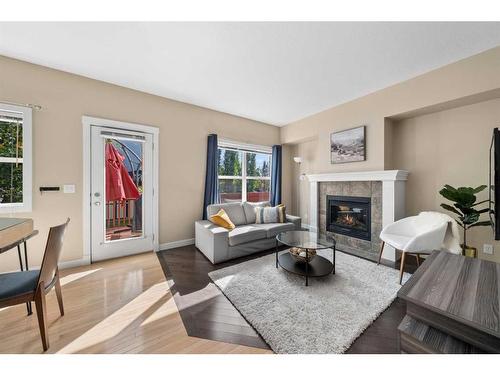 271 Cranston Drive Se, Calgary, AB - Indoor Photo Showing Living Room With Fireplace