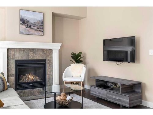 271 Cranston Drive Se, Calgary, AB - Indoor Photo Showing Living Room With Fireplace