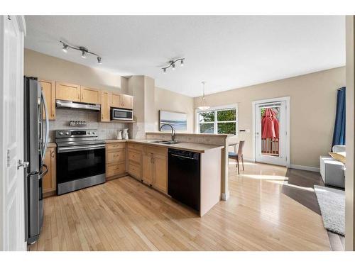 271 Cranston Drive Se, Calgary, AB - Indoor Photo Showing Kitchen With Double Sink