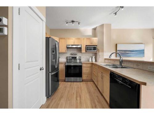 271 Cranston Drive Se, Calgary, AB - Indoor Photo Showing Kitchen With Double Sink