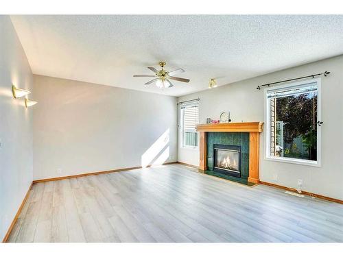 52 Somerrect Gardens Sw, Calgary, AB - Indoor Photo Showing Living Room With Fireplace