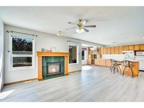 52 Somerrect Gardens Sw, Calgary, AB - Indoor Photo Showing Living Room With Fireplace