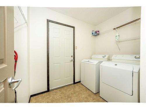 415 Cranston Drive Se, Calgary, AB - Indoor Photo Showing Laundry Room