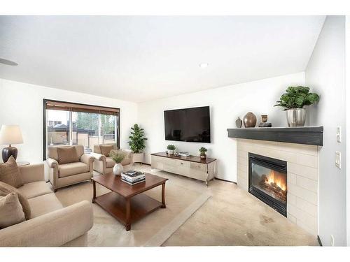 415 Cranston Drive Se, Calgary, AB - Indoor Photo Showing Living Room With Fireplace