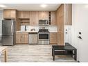 1110-350 Livingston Common Ne, Calgary, AB  - Indoor Photo Showing Kitchen With Stainless Steel Kitchen 