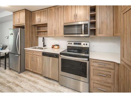 1110-350 Livingston Common Ne, Calgary, AB - Indoor Photo Showing Kitchen With Stainless Steel Kitchen With Double Sink