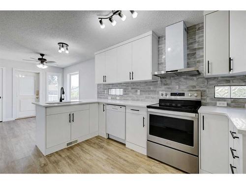 126 Springs Court Se, Airdrie, AB - Indoor Photo Showing Kitchen With Upgraded Kitchen