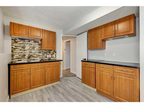 126 Springs Court Se, Airdrie, AB - Indoor Photo Showing Kitchen With Double Sink