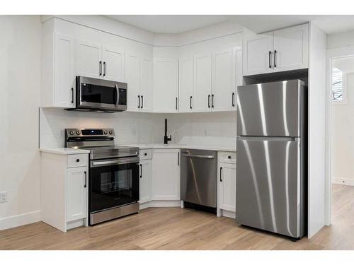 1112A Regent Crescent Ne, Calgary, AB - Indoor Photo Showing Kitchen With Stainless Steel Kitchen