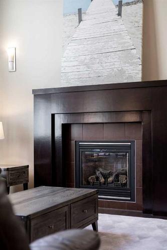 1 Cranberry Cove Se, Calgary, AB - Indoor Photo Showing Living Room With Fireplace