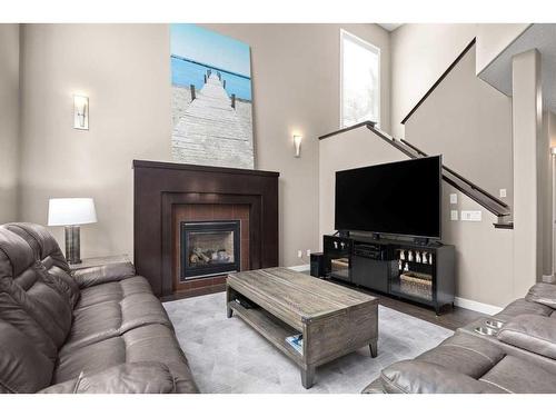 1 Cranberry Cove Se, Calgary, AB - Indoor Photo Showing Living Room With Fireplace