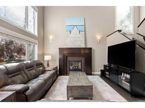 1 Cranberry Cove Se, Calgary, AB - Indoor Photo Showing Living Room With Fireplace