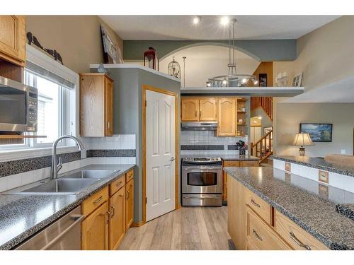 151 Riverview Circle Se, Calgary, AB - Indoor Photo Showing Kitchen With Double Sink