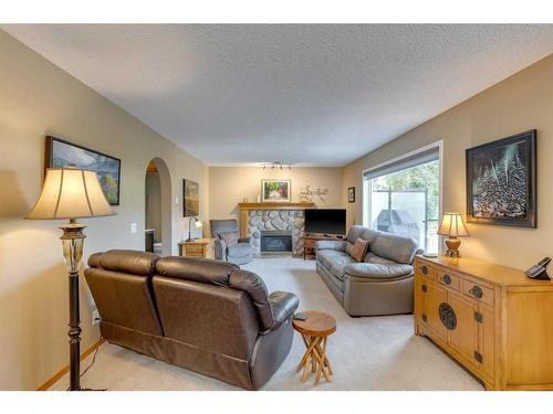 151 Riverview Circle Se, Calgary, AB - Indoor Photo Showing Living Room With Fireplace