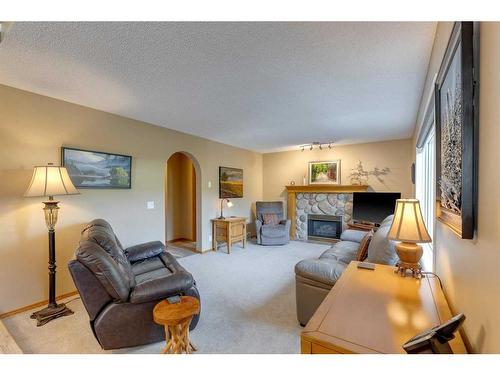 151 Riverview Circle Se, Calgary, AB - Indoor Photo Showing Living Room With Fireplace