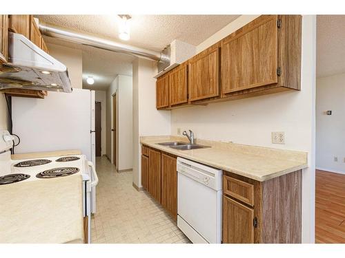 413-738 3 Avenue Sw, Calgary, AB - Indoor Photo Showing Kitchen With Double Sink