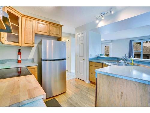 2266 Passchendaele Avenue Sw, Calgary, AB - Indoor Photo Showing Kitchen With Double Sink