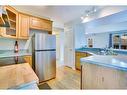 2266 Passchendaele Avenue Sw, Calgary, AB  - Indoor Photo Showing Kitchen With Double Sink 